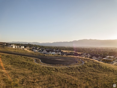 View of mountain backdrop featuring nearby suburban area