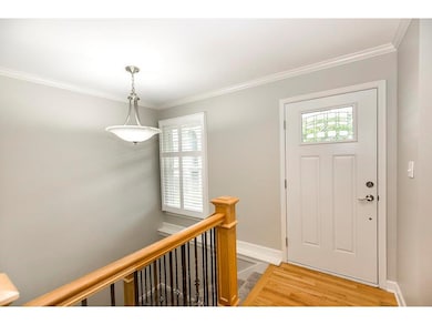 Light and bright entryway with open stairs to the 