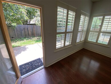 Entryway featuring dark wood-style floors and bas