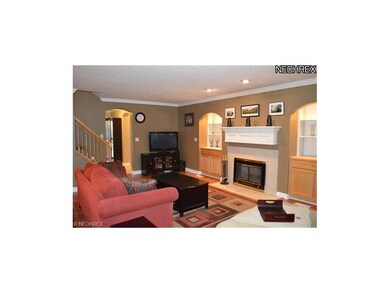 Cozy living room with a wood burning fireplace and
