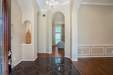 Step inside to tall ceilings, rich flooring, and a