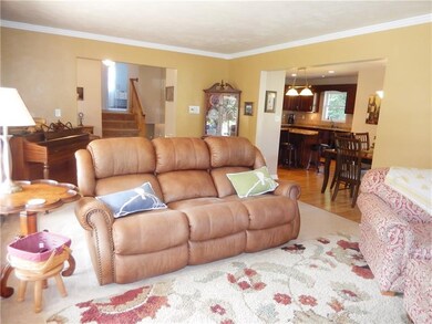 The living room flows into the dining and kitchen 