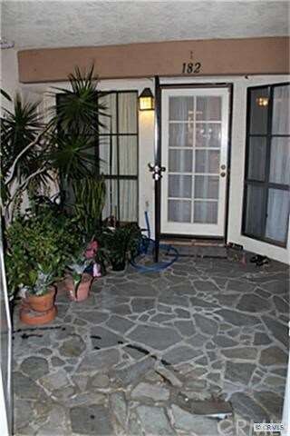 Front door (w/ security door) and courtyard.