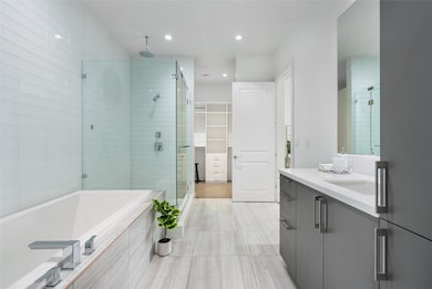 Why go to the spa when you have a bathroom like this??? Elegant tile compliments quartz counters, and modernized cabinetry