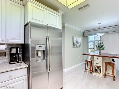 Kitchen featuring stainless steel fridge with ice