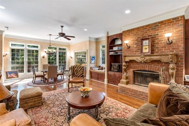 Large Family Room off Kitchen with fireplace and built-in bar.