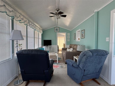 A bright living room comes fully furnished