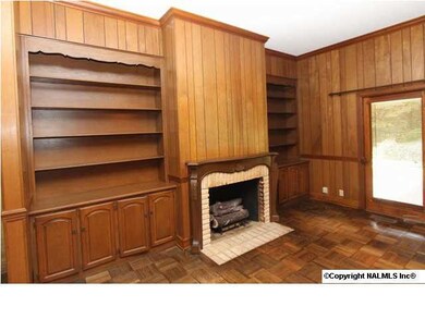 Built-ins and Gas log fireplace in living area