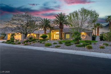 View of front of home with a tile roof and stucco