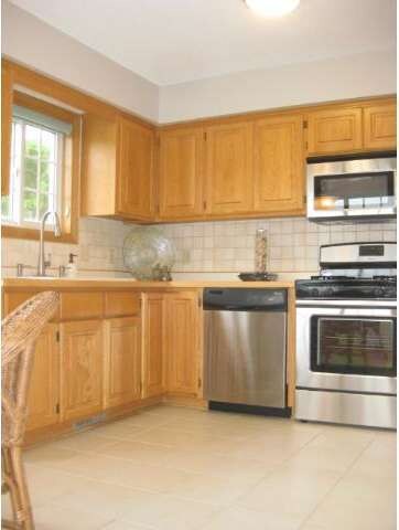 New stainless steel appliances, tiled floor and ge