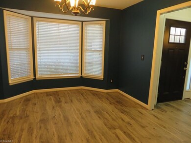 Formal dining with bay window