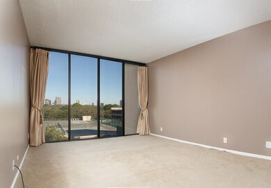 Huge Master Bedroom features floor to ceiling wind