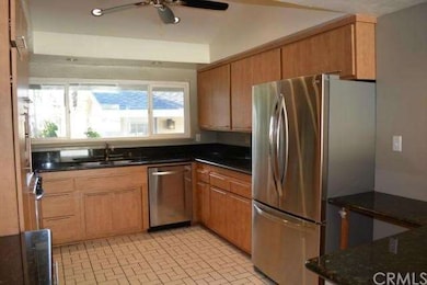 Kitchen area with granite countertops, updated cab
