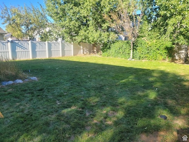 View of fenced backyard