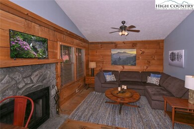 Great room with gorgeous wood floors and wood-burn
