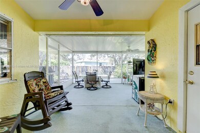 Covered patio area w/door to bath.