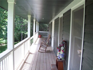 View of covered porch, front and 2 sides