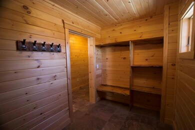 Awesome mudroom with pocket door and...
