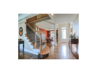 Enter the home to the hardwood foyer.
