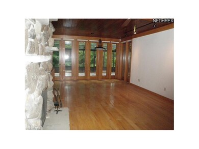 Great room shows beautiful wood floor and ceiling!