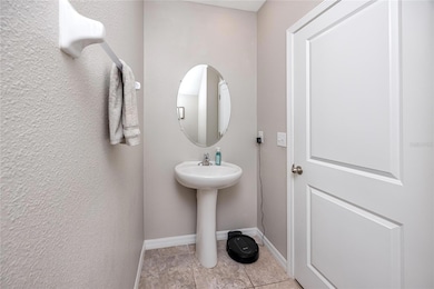 Half Bath at 7034 Emerald Spring Lp, New Port Richey, FL 34653 at Copperspring