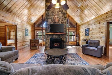 Living room featuring wood ceiling, light wood-typ
