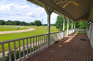 Relax on the large country porch and watch the hor
