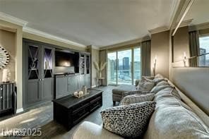 Living area with crown molding and wood finished floors