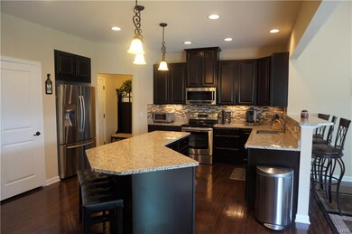 A closer look at the kitchen exposes the sleek gra