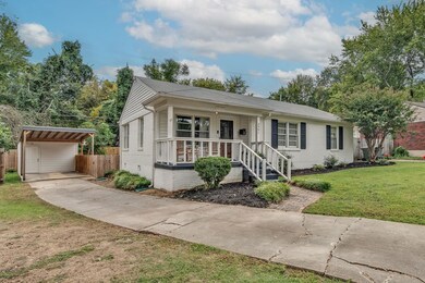 View of front facade with a front lawn and a porch