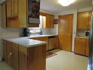 Lots of cabinets in this efficient kitchen.