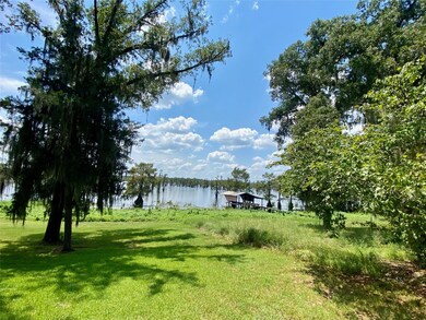 View of yard with a water view