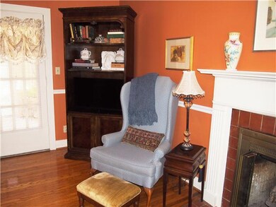 The Living Room has a fireplace and opens to the Dining Room on one side and the bedrooms on the other