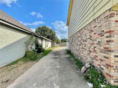 Drive way leading to back detached garage