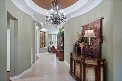 A view into the home from the entry door. Notice the curved walls and architectural detail.