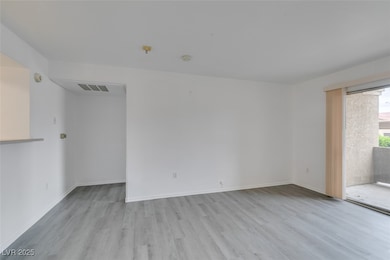Unfurnished room featuring light wood finished flo