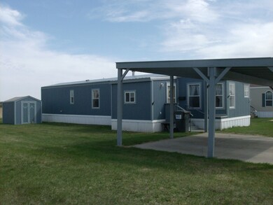 North side view/entry/storage shed