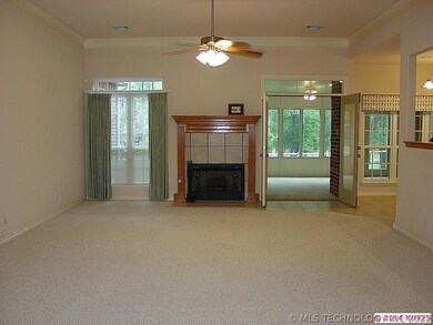 Gas log FP and french doors that lead to enclosed