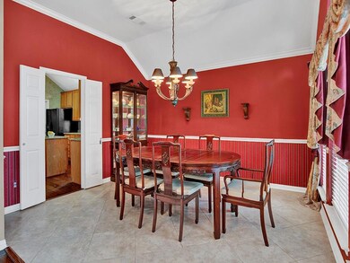 Formal dining room has an easy care tile floor - o