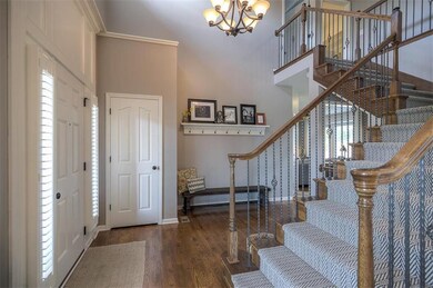 Entry into home. Newer carpet, hardwood floors, an