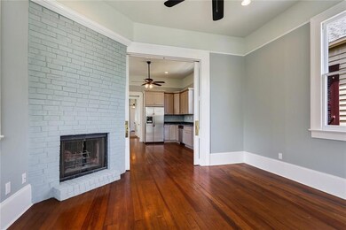Front living room at entry with working wood firep