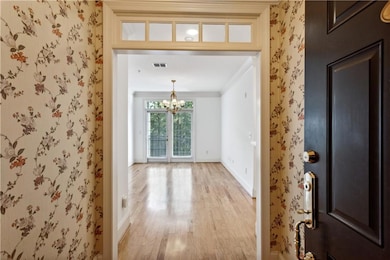 Entryway featuring french doors, a notable chandel