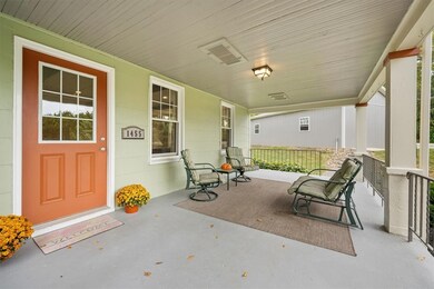 As you walk onto the sprawling front porch you are