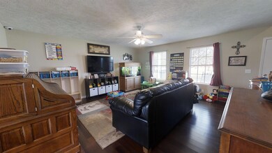 Huge living room with gorgeous new dark hardwood floors!