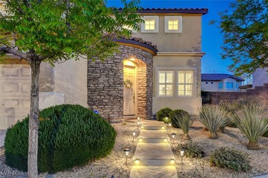 View of front of property with stucco siding, ston
