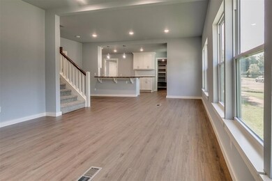 Unfurnished living room with wood-type flooring