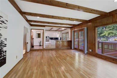 Living room with beautiful hardwood floors, opens 