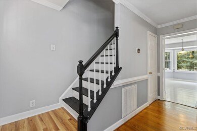 awesome entry way.  Stairs are so pretty! Wood flo