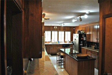 Kitchen w. granite countertops and Thermador appli