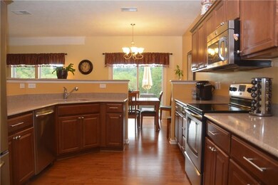 Open concept kitchen with quartz countertops, stai